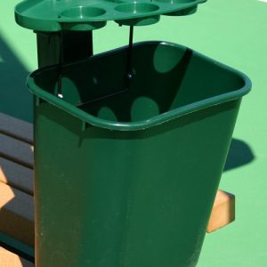 Green Tennis Court Tidy mounted on a tennis post with storage tray and waste basket.